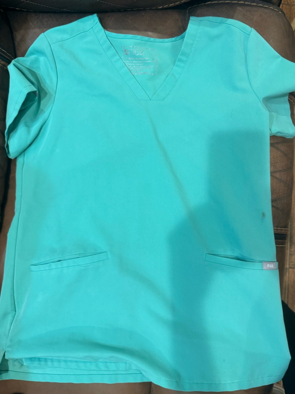 Figs surgical green color Small set with blue tie on pants.